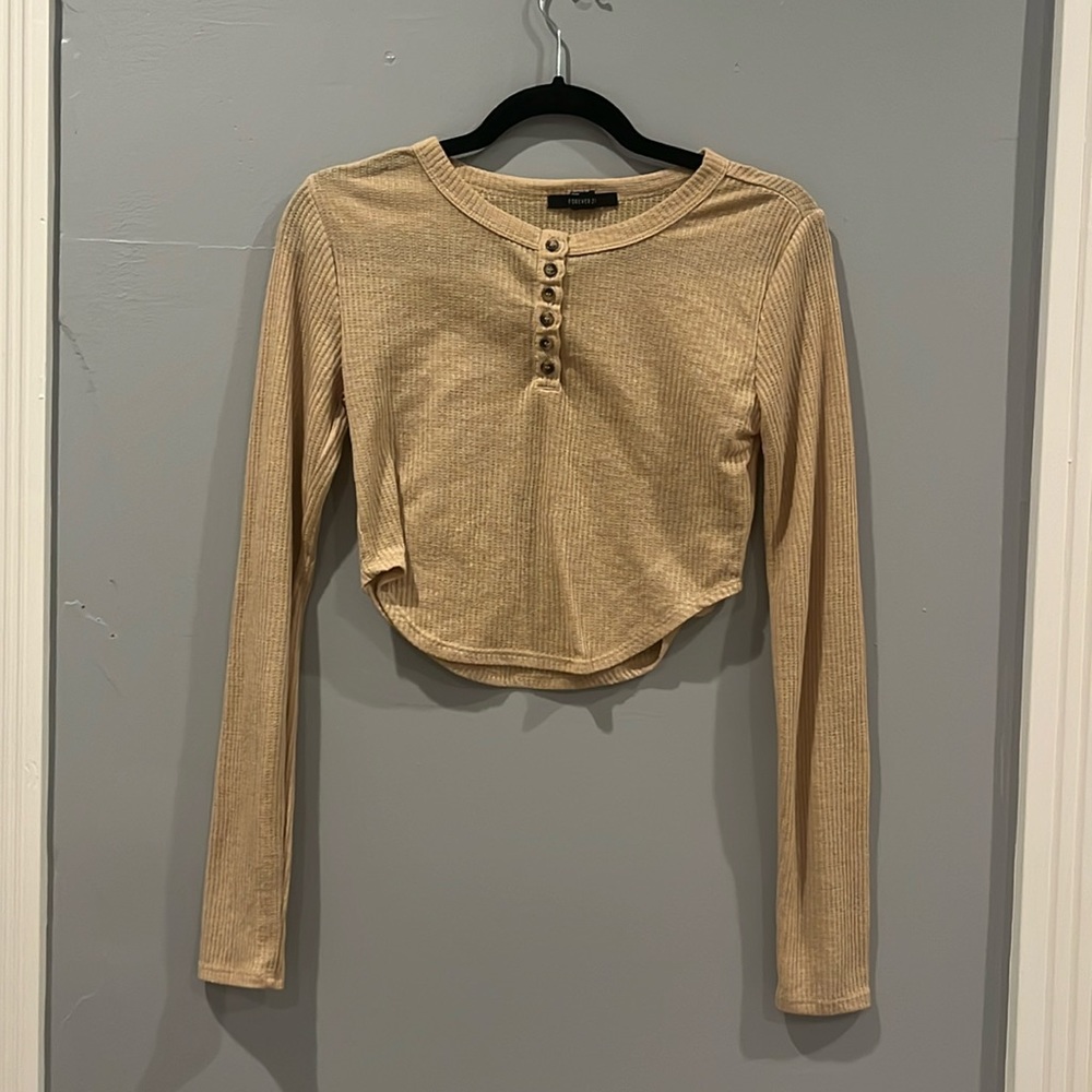A beige cropped long sleeve